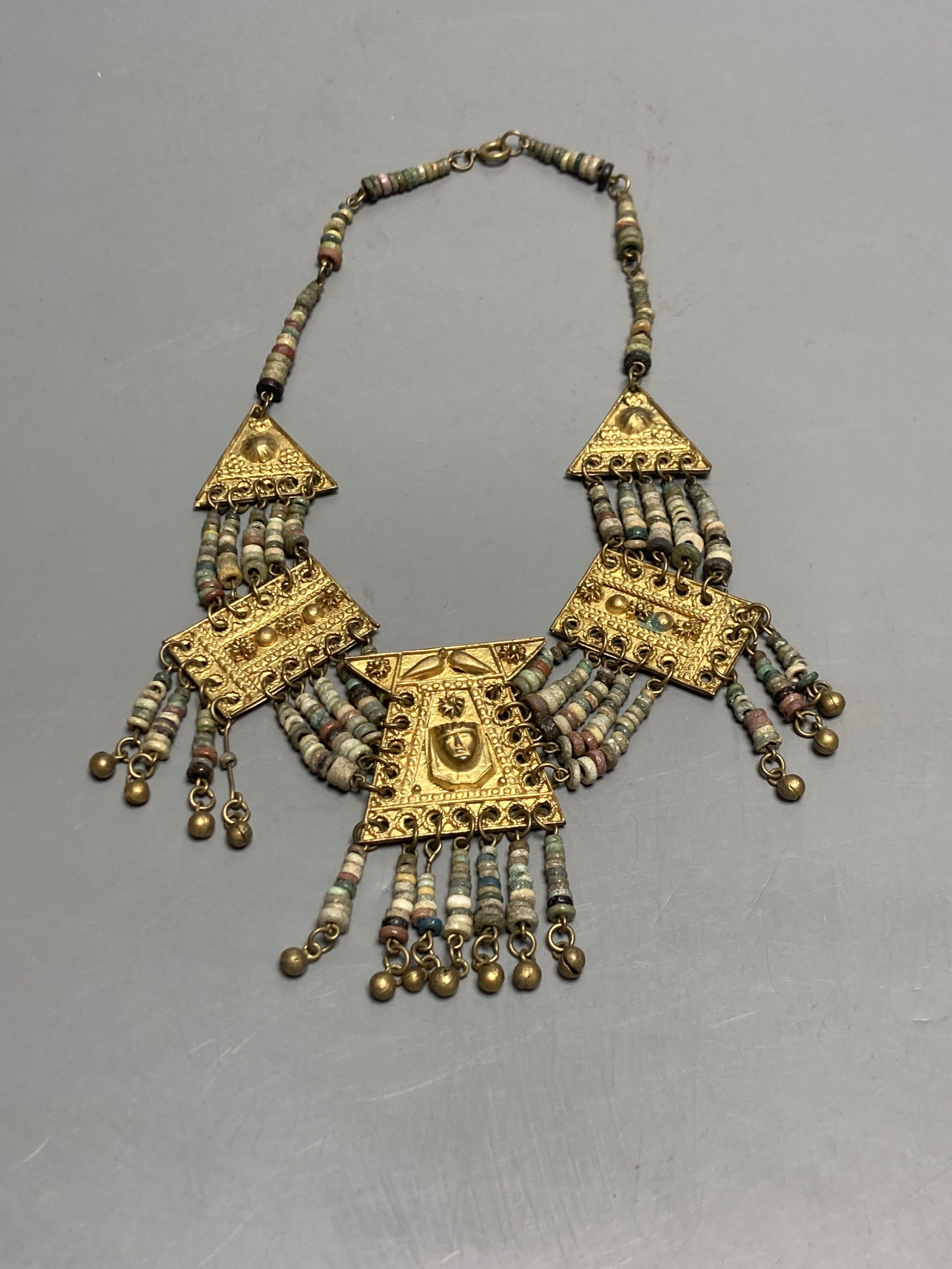 An antique Mayan? gilt metal and hardstone set drop necklace, 42cm.